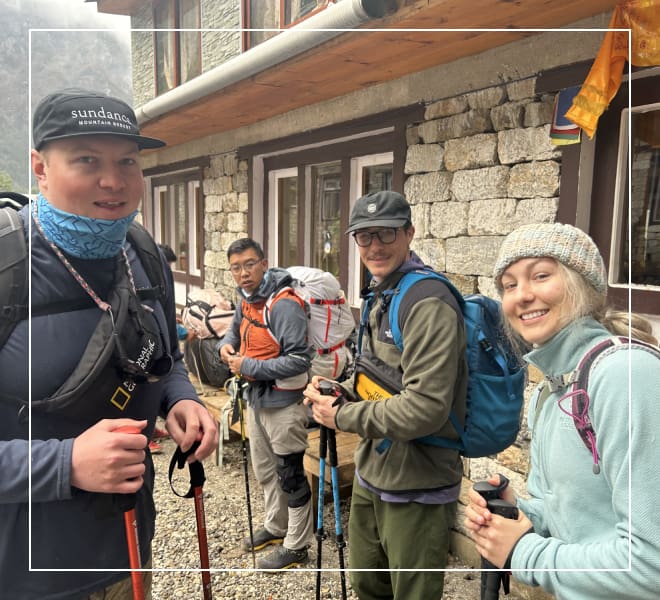 A group of people with backpacks and hiking poles.