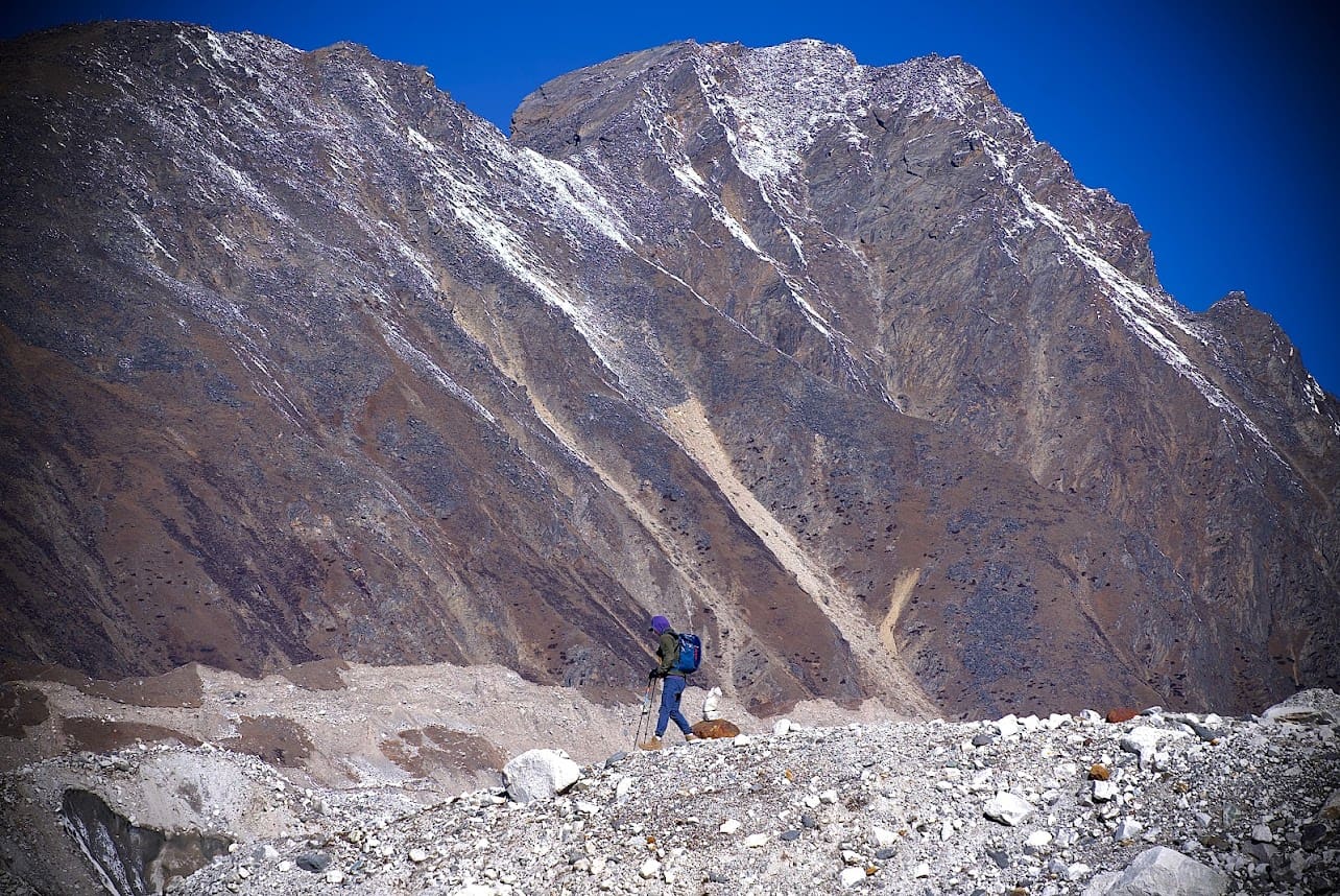 A person standing on top of a mountain.